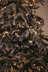 Beautiful indoor interior christmas decorations. Gold Christmas background of de-focused lights with decorated tree