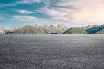 Fotobehang Empty asphalt road and mountain under blue sky © ABCDstock