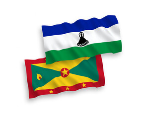 National vector fabric wave flags of Grenada and Lesotho isolated on white background. 1 to 2 proportion.