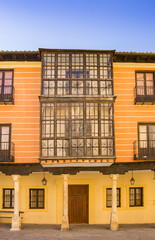 Bay window on a colorful house in the historic center of Burgo de Osma, Spain