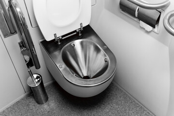 vacuum toilet in a passenger train carriage