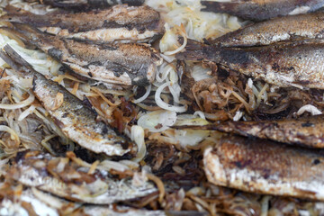 Herring on a grill on the market