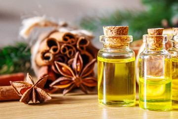 Christmas essential oils in a small bottle. Selective focus.