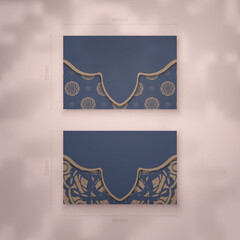 Business card in blue with a greek brown pattern for your brand.