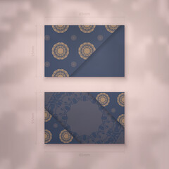Business card in blue with a luxurious brown pattern for your business.