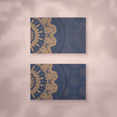 Business card in blue with a luxurious brown pattern for your business.