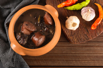 Feijoada typical Brazilian food. Traditional Brazilian food made with black beans. Top view. copy space