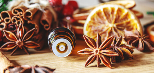 Christmas essential oils in a small bottle. Selective focus.