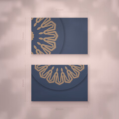 Business card in blue with abstract brown ornament for your brand.