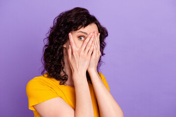 Profile side photo of young lady cover face fingers look see horrified scared isolated over violet color background