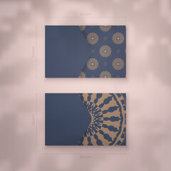 Business card in blue with an abstract brown pattern for your contacts.