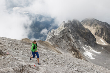 Fototapeta premium Women trail running in the European alps of Austria