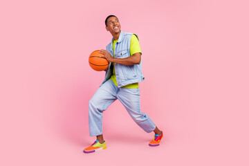 Full size photo of funny millennial brunet guy play basketball wear t-shirt vest jeans footwear...