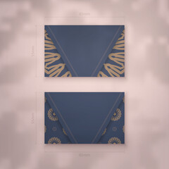 Business card in blue with greek brown pattern for your personality.