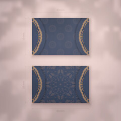 Business card in blue with Indian brown ornament for your brand.