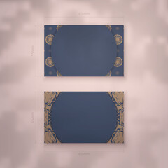 Business card in blue with Indian brown pattern for your business.