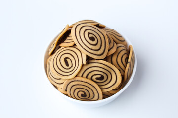 Kue Kuping Gajah, traditional cookies from Indonesia. Sweet and crunchy, unique spiral pattern. Isolated in white background.