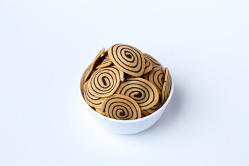 Kue Kuping Gajah, traditional cookies from Indonesia. Sweet and crunchy, unique spiral pattern. Isolated in white background.