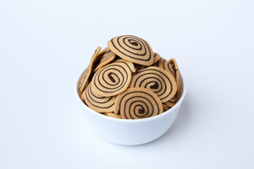 Kue Kuping Gajah, traditional cookies from Indonesia. Sweet and crunchy, unique spiral pattern. Isolated in white background.