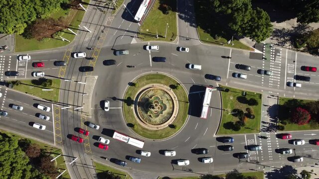 Aerial drone footage of a traffic circle intersection in the heart of Seville city in Andalusia, Spain