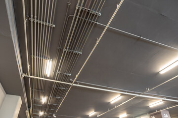 Installation of Electrical metallic conduits on the ceiling