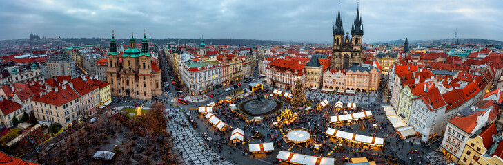 Elevated, panoramic view of the skyline of Prague during a cold winter day with the traditional...