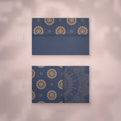 Business card in blue with luxurious brown ornaments for your personality.