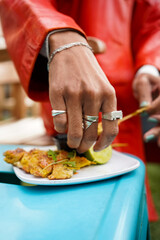 Close-up of hand of woman eating snack