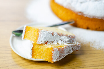Portion of Madeira ring loaf cake served on a small plate