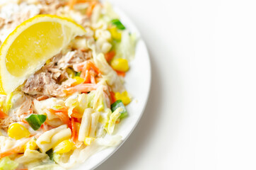 Cavatelli pasta with tuna and iceberg lettuce, carrots, sweet corn and cucumber in a sauce mayonnaise