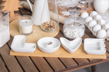 Composition of ingredients for a delicious homemade cake on a wooden table.