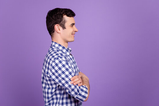 Profile side photo of young confident business man crossed hands look empty space isolated over violet color background