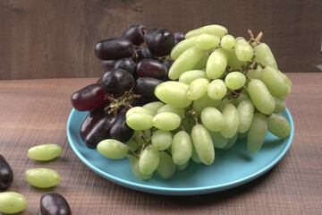 Natural organic different types of fresh ripe juicy grapes and space for text on table. top view, Agriculture concepts.