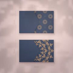 Business card template in blue with abstract brown ornament for your business.