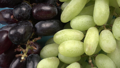Natural organic different types of fresh ripe juicy grapes and space for text on table. top view, Agriculture concepts.