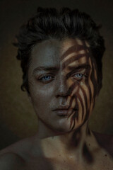 Beautiful male portrait with a shadow