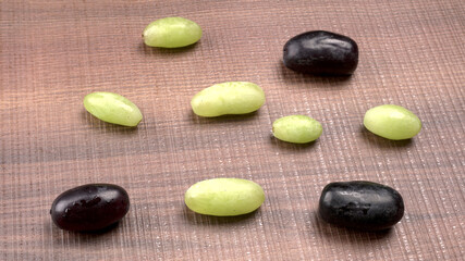 Natural organic different types of fresh ripe juicy grapes and space for text on table. top view, Agriculture concepts.