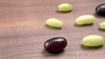 Natural organic different types of fresh ripe juicy grapes and space for text on table. top view, Agriculture concepts.