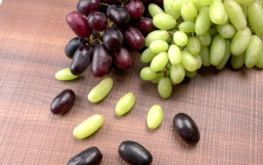 Natural organic different types of fresh ripe juicy grapes and space for text on table. top view, Agriculture concepts.