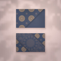Business card template in blue with Indian brown ornaments for your business.