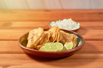 Authentic street barbacoa tacos on a wooden table. Mexican food concept.