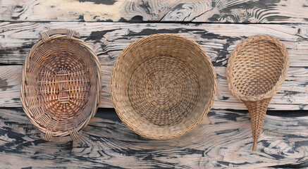 Fototapeta na wymiar wicker baskets on a wood background