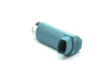 Closeup of asthma aerosol inhaler on white background