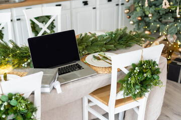 Laptop on Christmas kitchen interior design front view