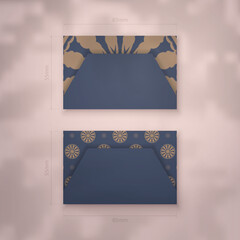 Business card template in blue with vintage brown ornaments for your personality.