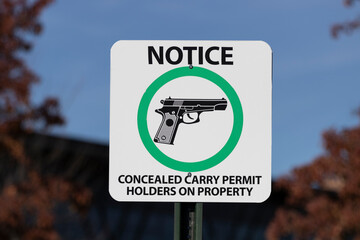 NOTICE - CONCEALED CARRY PERMIT HOLDERS ON PROPERTY sign. CCW or carrying a concealed weapon...