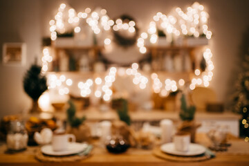 defocus. Christmas decor. garlands on decorated in kitchen for new year. 