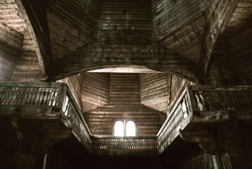 Interior of an old, abandoned wooden church.