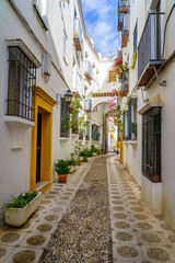 Beautiful narrow street in the Jewish quarter of the medieval city of Cordoba, Spain.