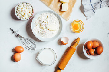 top view on light background with ingredients for making dough